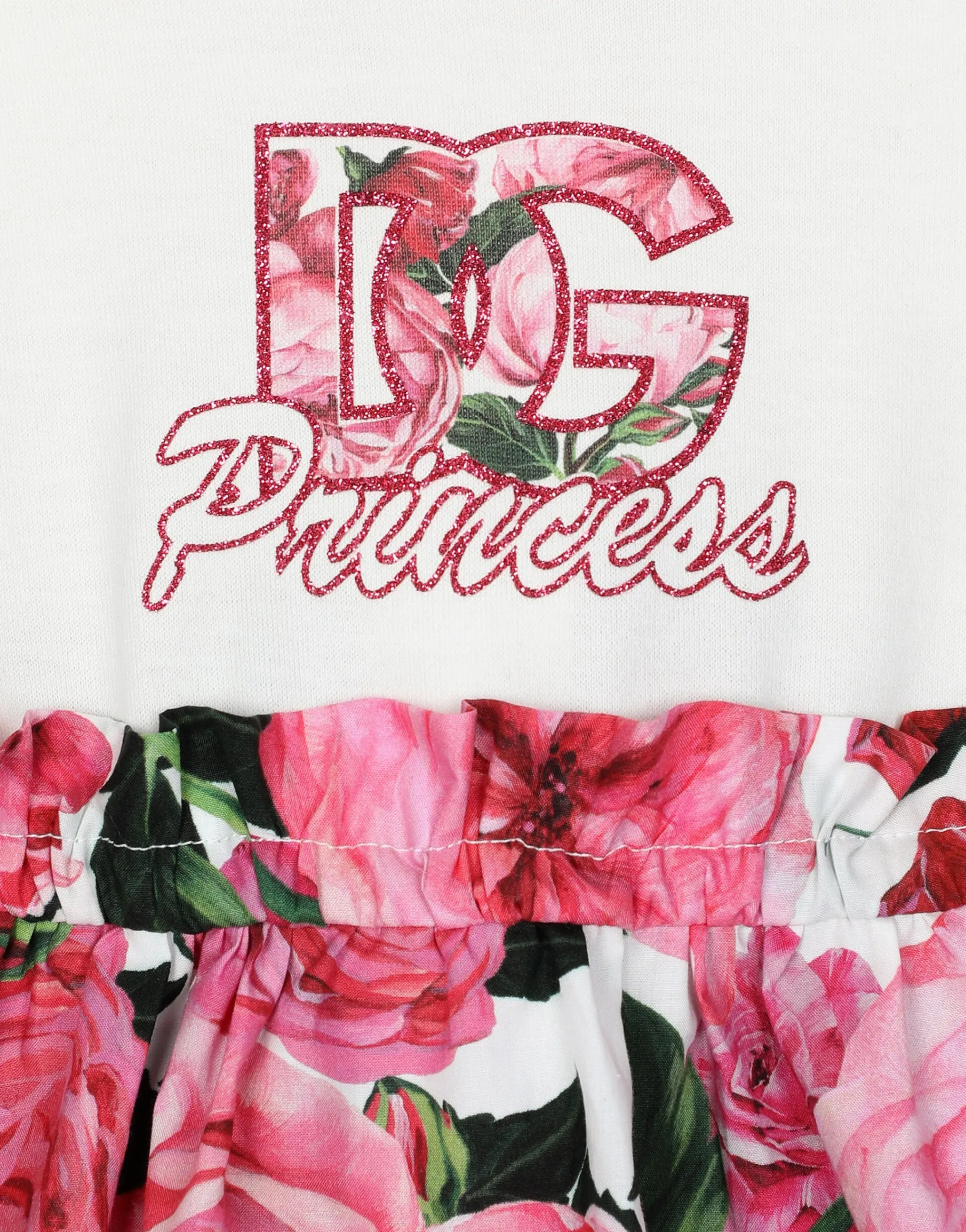 Poplin and jersey dress with rose print over a white background