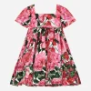 Poplin dress with rose print over a white background