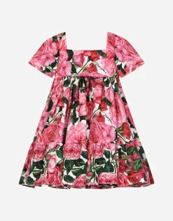 Poplin dress with rose print over a white background