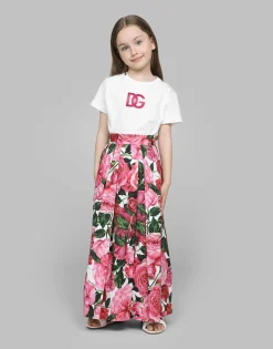 Poplin dress with rose print over a white background