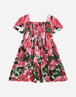 Poplin dress with rose print over a white background
