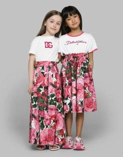 Poplin dress with rose print over a white background