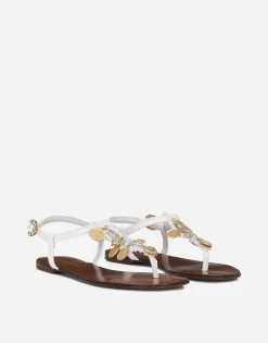 Raffia thong sandals with embroidered votive medallions