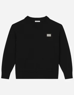 Round-neck plain knit sweater with logo tag