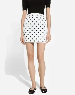 Short charmeuse skirt with polka-dot print