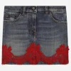 Short denim skirt with lace insert