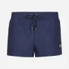 Short swim trunks with branded tag