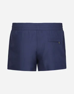 Short swim trunks with branded tag