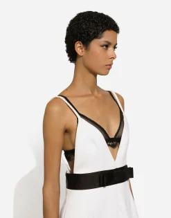 Short woolen dress with satin belt and straps