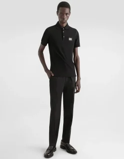 Stretch cotton pants with branded tag