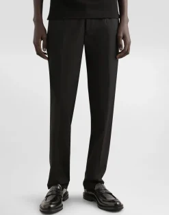 Stretch cotton pants with branded tag