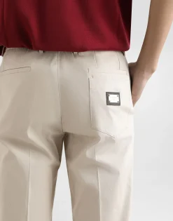 Stretch cotton pants with branded tag