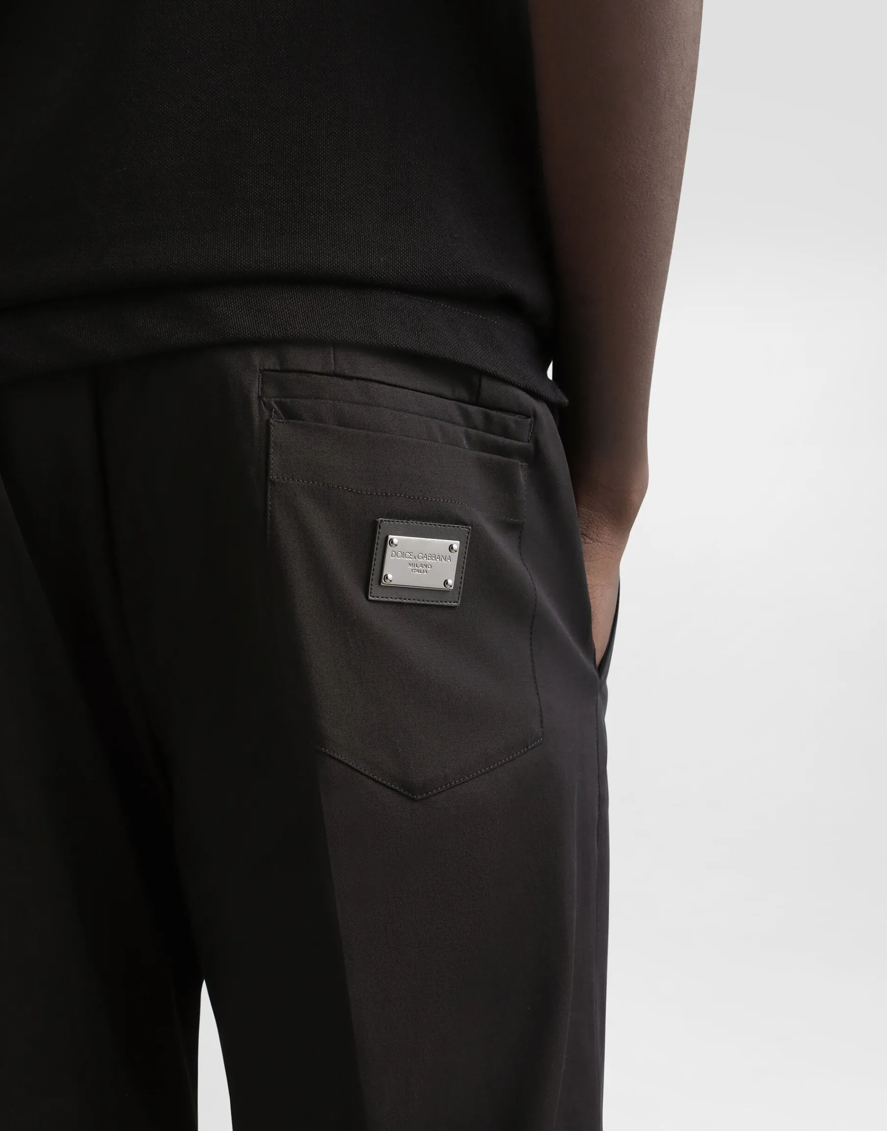 Stretch cotton pants with branded tag