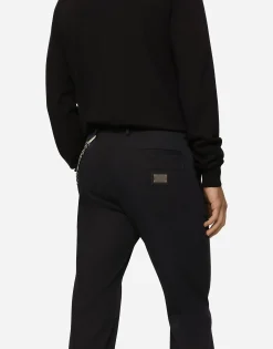Stretch cotton pants with branded tag