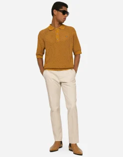 Stretch cotton pants with branded tag