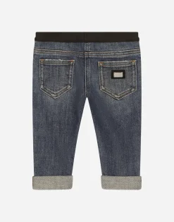 Stretch denim jeans with branded elastic