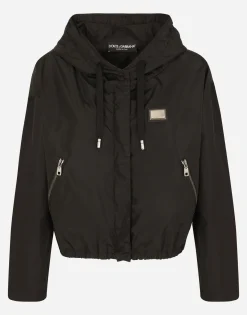 Technical fabric windbreaker with hood
