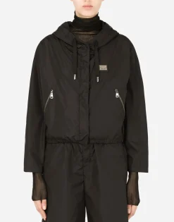 Technical fabric windbreaker with hood