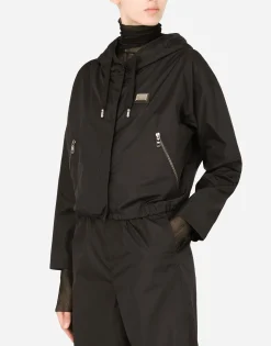 Technical fabric windbreaker with hood