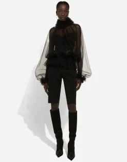 Tulle blouse with ruffles on the neck and cuffs