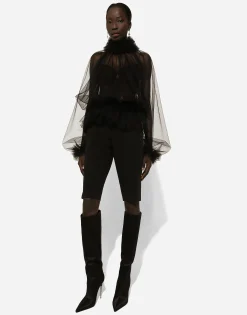 Tulle blouse with ruffles on the neck and cuffs