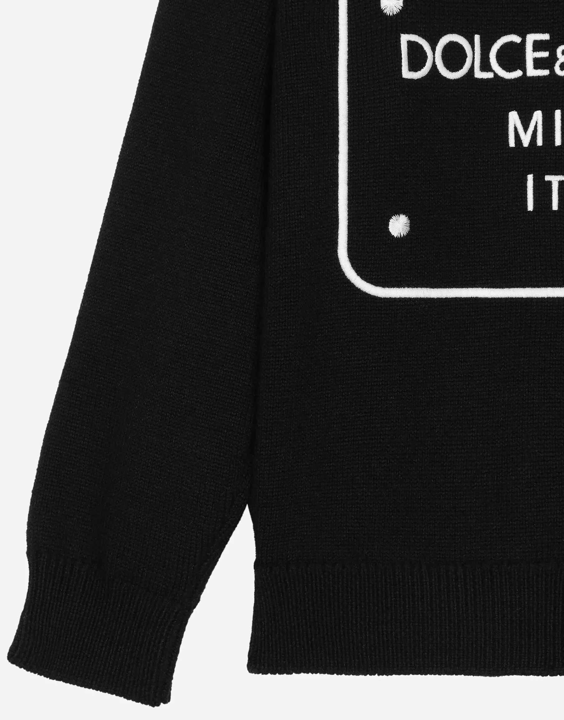 Wool pullover with branded tag