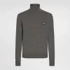 Wool turtle-neck sweater with branded tag