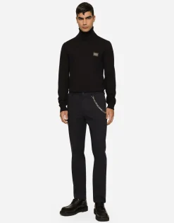 Wool turtle-neck sweater with branded tag